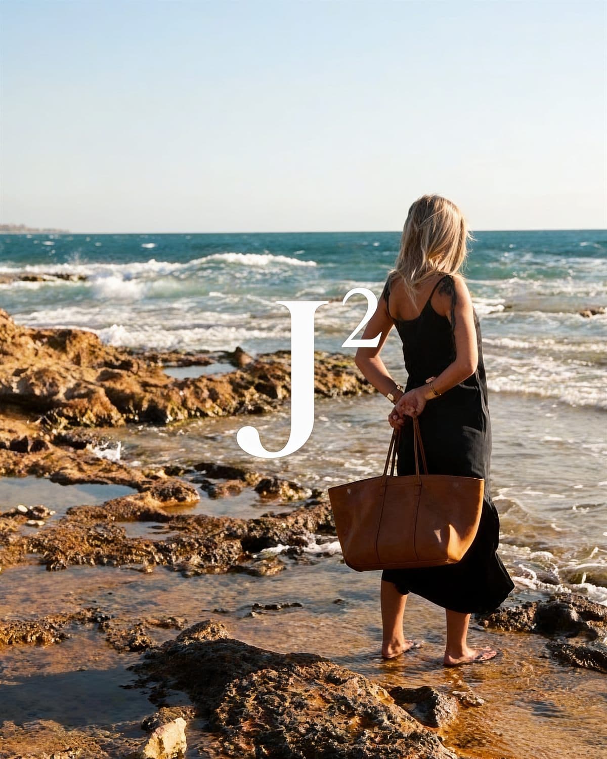 Walking the shoreline with the Tan tote, the J² monogram overhead